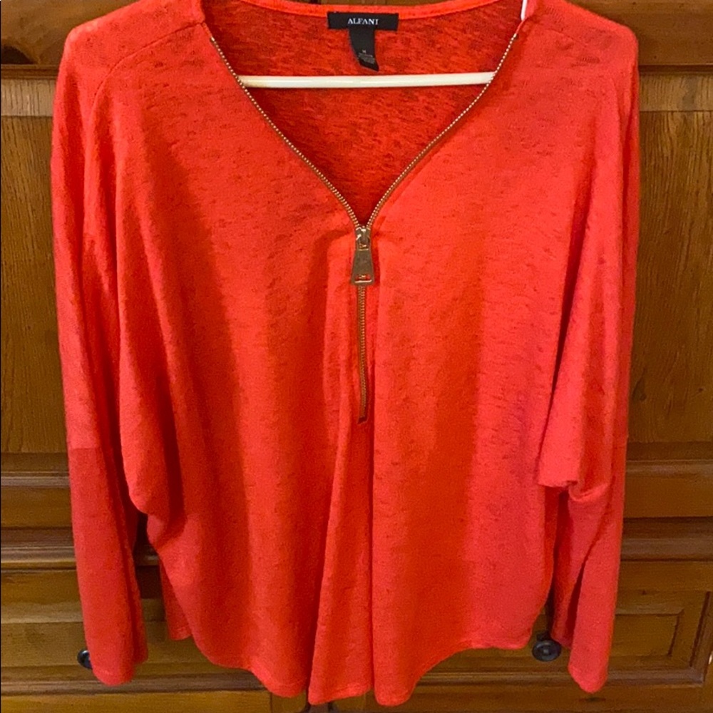 Orange sweater.